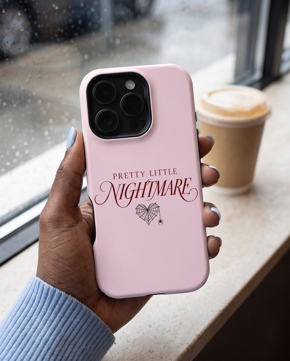 Pretty Little Nightmare iPhone case, in hand