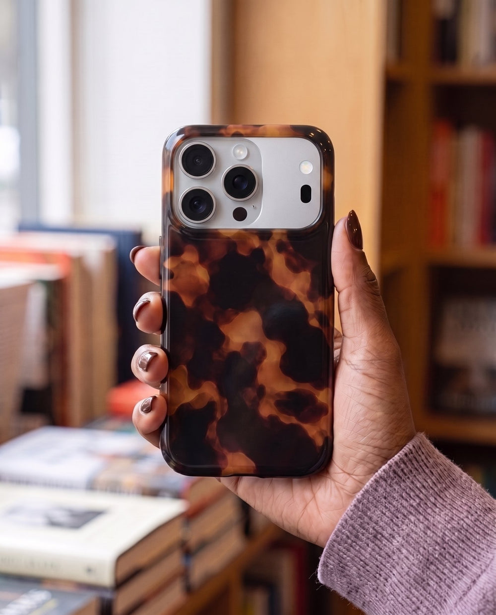 Smoked Tortoise iPhone case, in hand